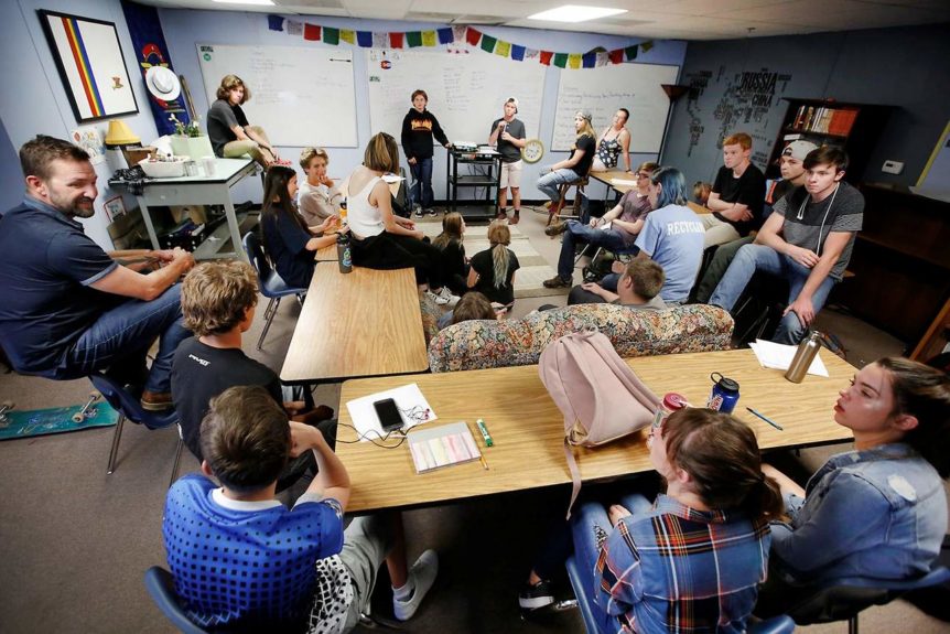 Students in discussion group with Teacher Shane Nelson