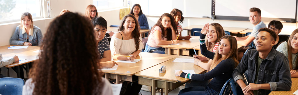 Looking over teacher's shoulder at students